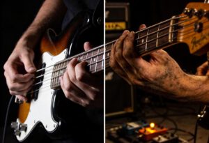 Nahaufnahme von Händen, die einen Bass spielen. Eine Hand drückt die Saiten, die andere schlägt sie an.